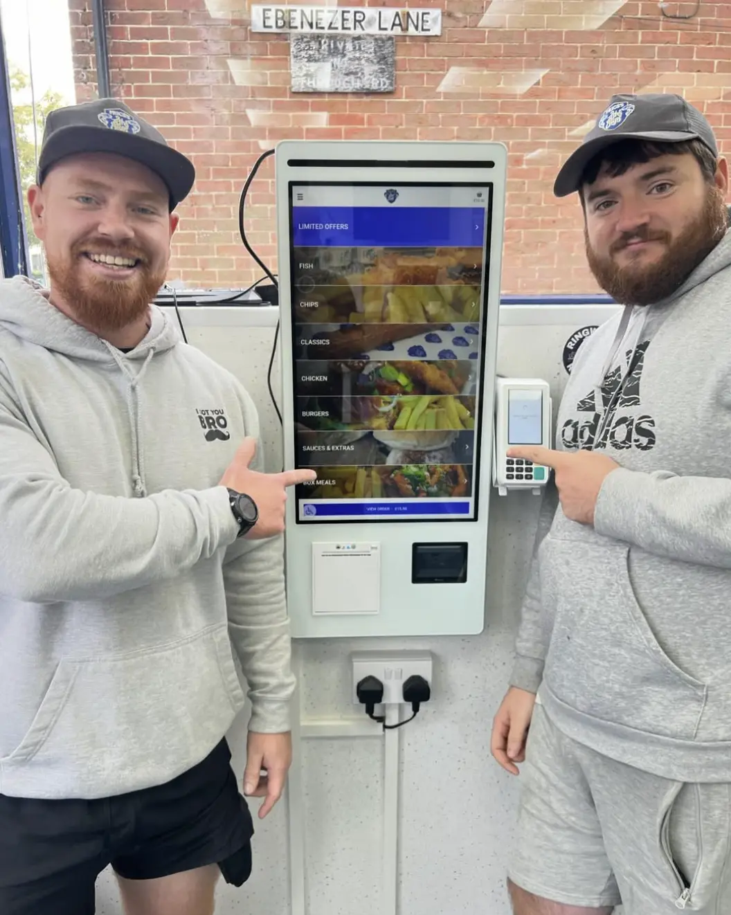 Customer with a self-service kiosk installation